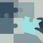 Hand places final puzzling piece