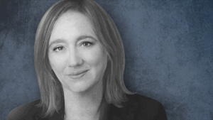 Portrait of Claudia Sahm on a blue background