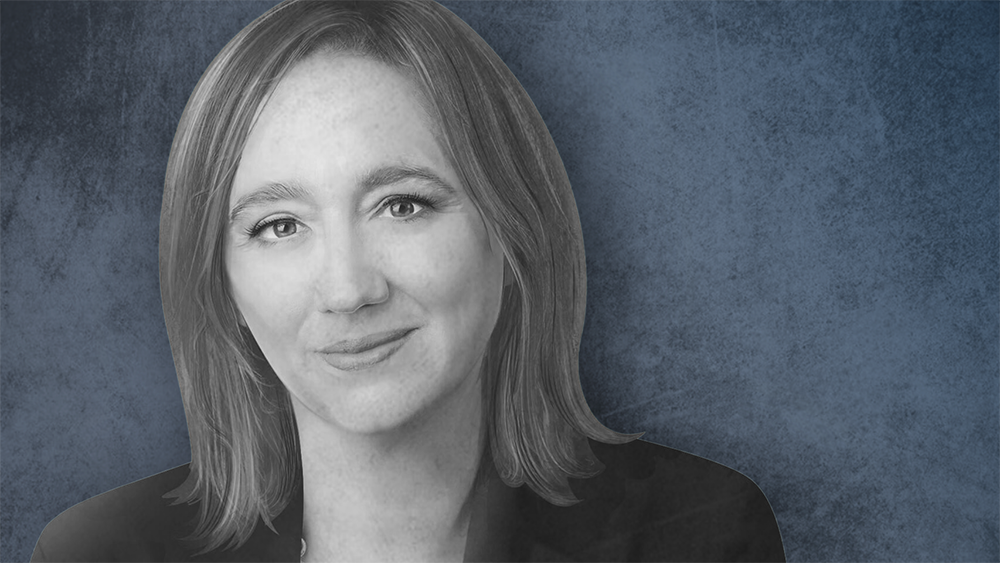 Portrait of Claudia Sahm on a blue background