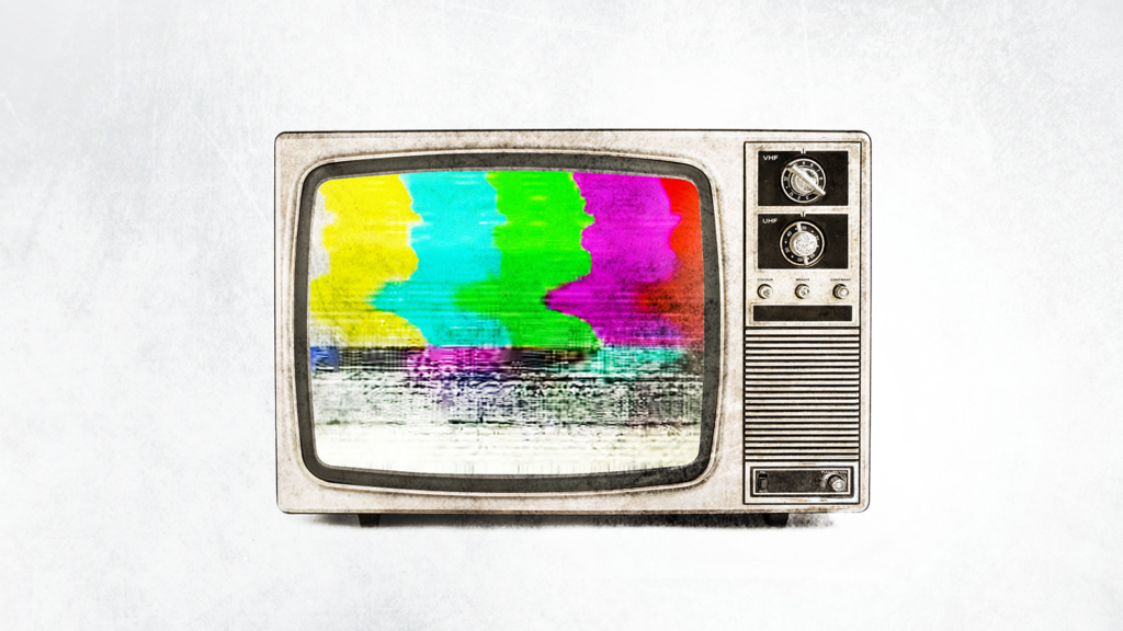 Old-style television set portraying an image of static.